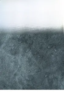 Detailed view of high-density waterproof and tear-resistant nylon fabric on the backpack