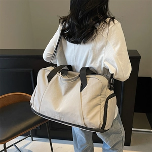 Minimalist beige travel bag with dry-wet separation and durable nylon fabric for fitness