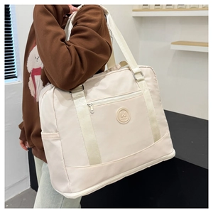 Detail of beige large capacity yoga fitness bag with durable oxford fabric on shoulder