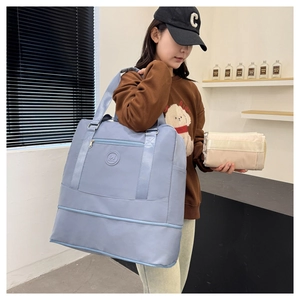 Foldable light blue travel bag detail showing its compact beige folded form for easy storage
