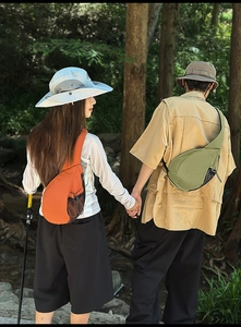 Outdoor crossbody chest bags in orange and green nylon with breathable mesh side pockets
