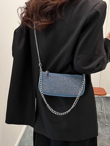 Blue denim crossbody bag with sparkling rhinestones and silver chain strap for women