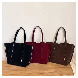 Three colors of suede tote bags with rivet details in black, burgundy, and coffee brown