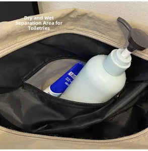 Detail of travel bag interior showing waterproof dry-wet separation compartment