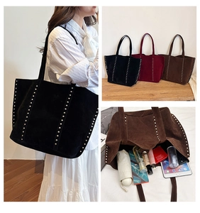 Nylon tote bag detail showing large capacity for tablet and cosmetics with silver studs