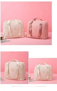 Pink and beige waterproof oxford travel bags with large capacity and front zip pocket