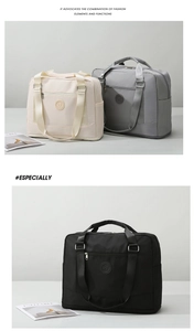 Detail of waterproof Oxford fabric and reinforced straps on travel duffel bag
