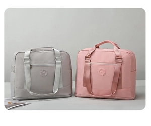 Macro shot of waterproof nylon travel bags in gray and pink with smooth textures