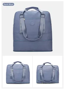 Close-up detail of dark blue waterproof oxford travel bag with reinforced webbing handles