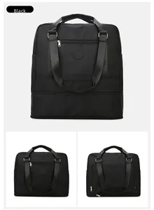 Detail of waterproof black travel bag with front zipper pocket and reinforced handles