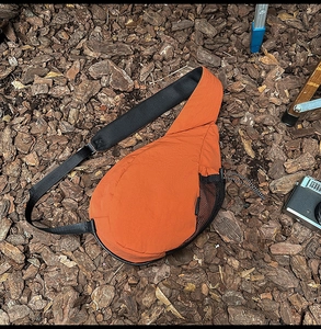 Detailed outdoor view of water-drop oxford fabric chest bag with mesh shoulder strap