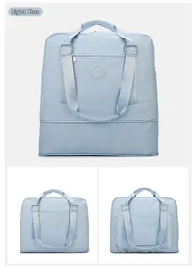 Macro view of light blue travel bag featuring expansion bottom and waterproof oxford fabric