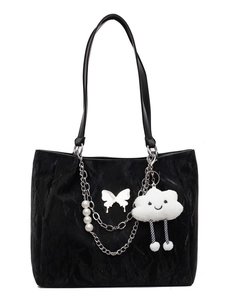Black velvet tote bag with silver butterfly, pearl chain and plush cloud charm on white base