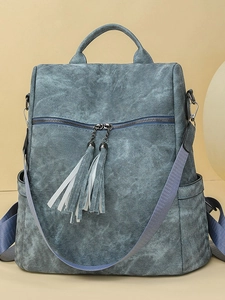 Versatile denim blue multi-functional backpack with stylish fringe zippers and wide strap