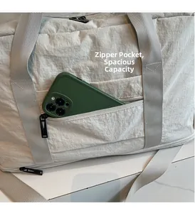 Macro shot of travel bag side zipper pocket showing ample capacity for a smartphone