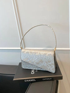 Silver snakeskin embossed handbag with asymmetric flap and golden metal hardware