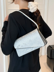 Silver snake pattern rectangular shoulder bag with metallic scales and crossbody strap