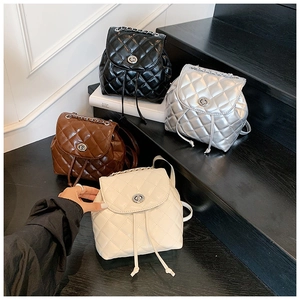 Quilted mini backpack collection in black silver brown and cream with chain straps