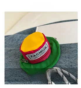 Detail view of hat-shaped mini storage pouch with red zipper and colorful design