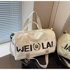 White gym bag with black logo featuring thick handles and adjustable shoulder strap