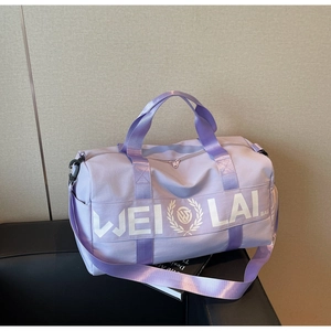 Detail of lavender nylon travel bag with logo and adjustable shoulder strap for gym