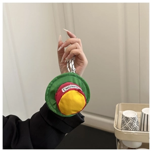 Detailed view of colorful hat-shaped pouch with zipper and portable lanyard for earphones