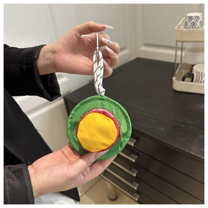 Mini hat-shaped earphone pouch in red, yellow, and green nylon with a metal carabiner