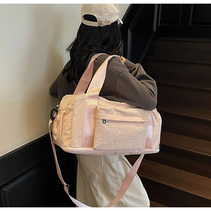 Large pink nylon travel bag with shoulder strap for fitness and yoga activities