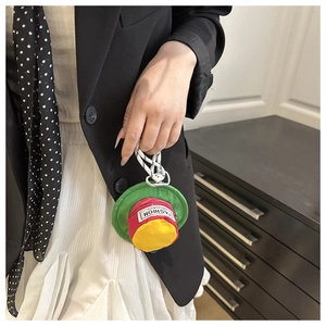 Macro shot of miniature hat-shaped earphone case with colorful canvas and zipper pouch