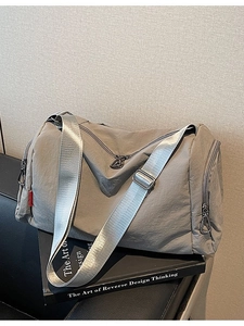 Gray large capacity nylon commuter pillow bag with adjustable silver shoulder strap