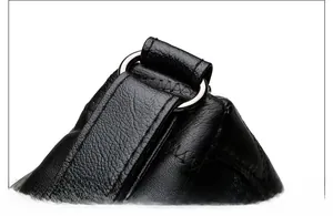 Detail of lychee pattern black leather bag with reinforced stitching and silver D-ring