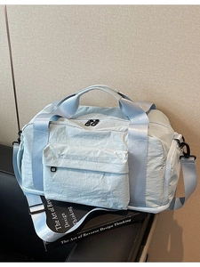 Large mint blue travel duffel bag made of waterproof nylon for fitness and travel