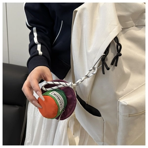 Detail showing colorful hat-shaped earphone pouch clipped to a beige backpack