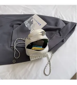 Internal view of the quilted chain bag showing space for a wallet, phone and power bank
