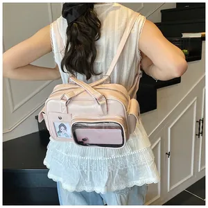 Pink PU leather bowling bag with transparent card slots and dual shoulder strap details