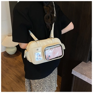 Detail of cream glossy leather tote bag with double clear windows for customization