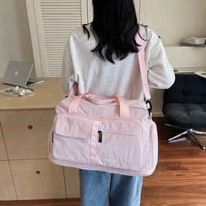 Pink lightweight nylon travel bag with large capacity and multi-pocket functional design
