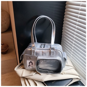 Close-up of metallic silver bowling bag with transparent front pocket and glossy PU leather