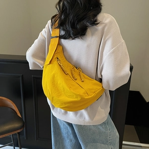 Modern yellow crescent dumpling crossbody bag in durable canvas for summer casual style