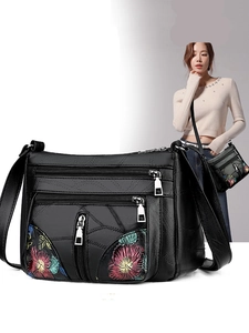 Black soft leather shoulder bag for women with floral embroidery and multi-zipper pockets