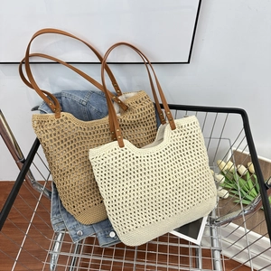 Detail of woven mesh tote bags in cream and khaki with premium leather handles