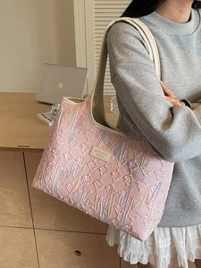 Fashionable pink tote bag with rainbow embroidery and textured monogram design
