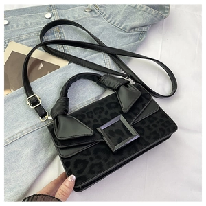 Detail of leopard print crossbody bag with matte square buckle and horsehair texture