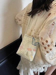 Green crossbody bag with butterfly embroidery and elegant floral patterns for women