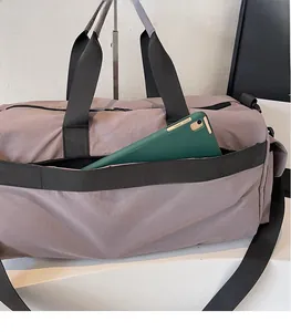 Detail of travel bag showing side zipper pocket holding a tablet for organized storage