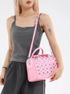 Pink patent leather Boston bag with silver rivets and adjustable shoulder strap