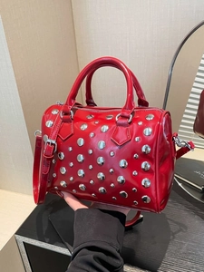 Red punk style bowling handbag with silver rivets and shiny finish for women
