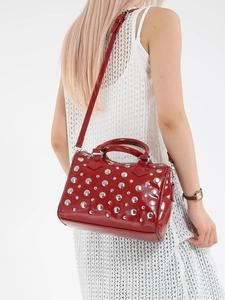 Burgundy patent leather Boston bag with silver rivets and adjustable shoulder strap