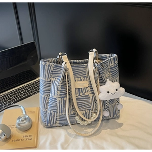 Blue and white woven tote bag featuring pearl chain detail and cute cloud charm