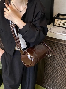 Vintage cylinder shoulder bag in dark brown glossy leather with adjustable strap